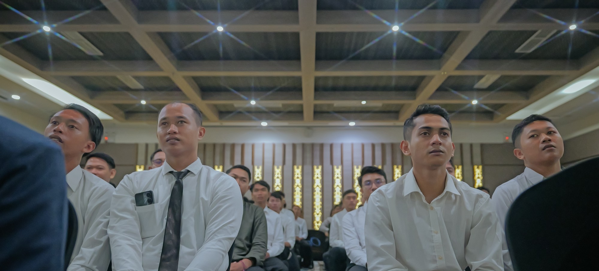 Candidates in a pre-departure compliance briefing